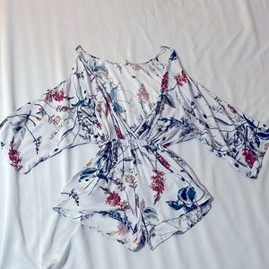 Elan tropical floral print short jumpsuit.
